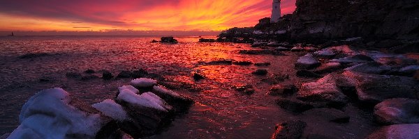 Zachód słońca, Cape Elizabeth, Latarnia morska Portland Head Light, Stan Maine, Stany Zjednoczone, Skały, Wybrzeże