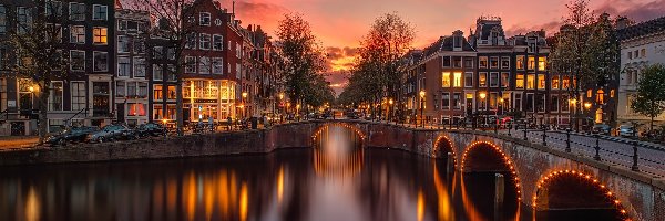 Drzewa, Most, Rzeka, Amsterdam, Holandia, Zachód słońca, Światła, Kanał Leidsegracht, Domy