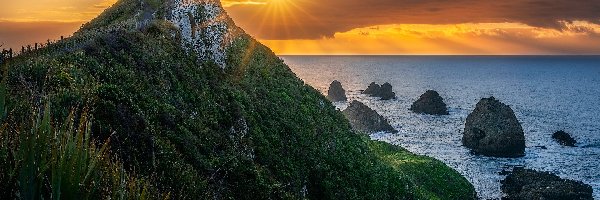 Nowa Zelandia, Nugget Point Lighthouse, Skały, Latarnia morska, Morze, Otago, Promienie słońca